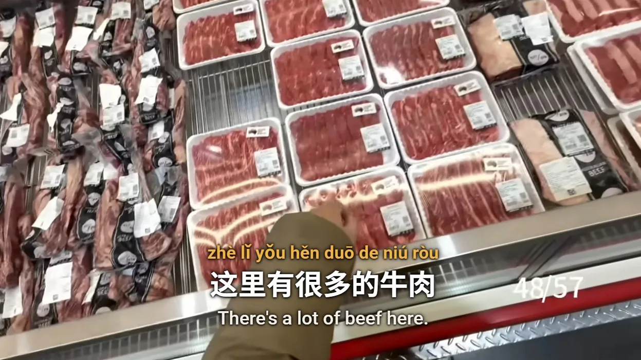 Supermarket beef counter with three-line subtitles: pinyin, Chinese characters and English