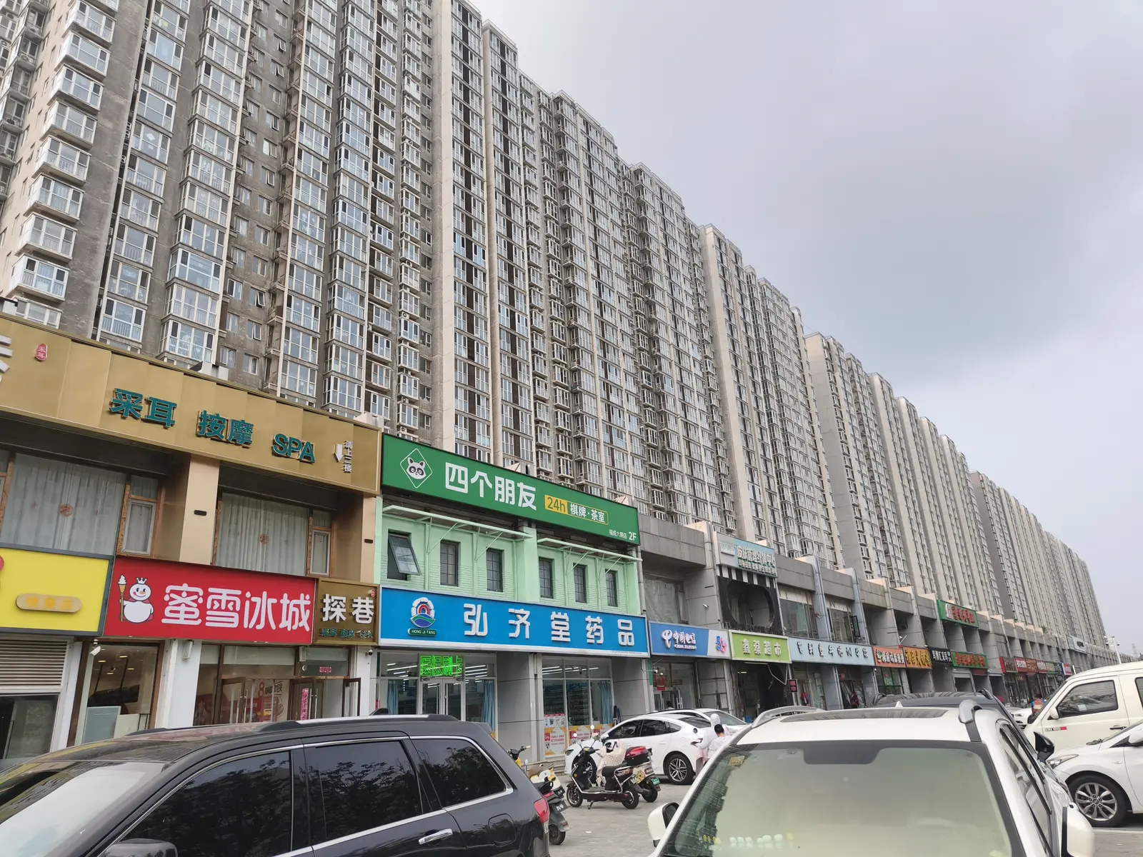 Endless rows of apartment towers with ground-floor shops near Beijing, China